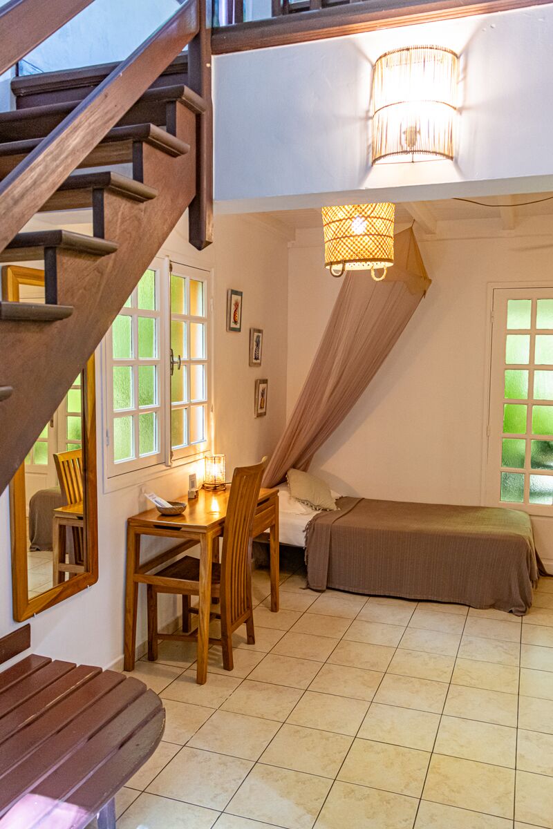 Un lit dans le Caraïb'Bay Hôtel