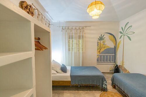 Lits dans une chambre de la villa Kariakou du Caraïb'Bay Hôtel